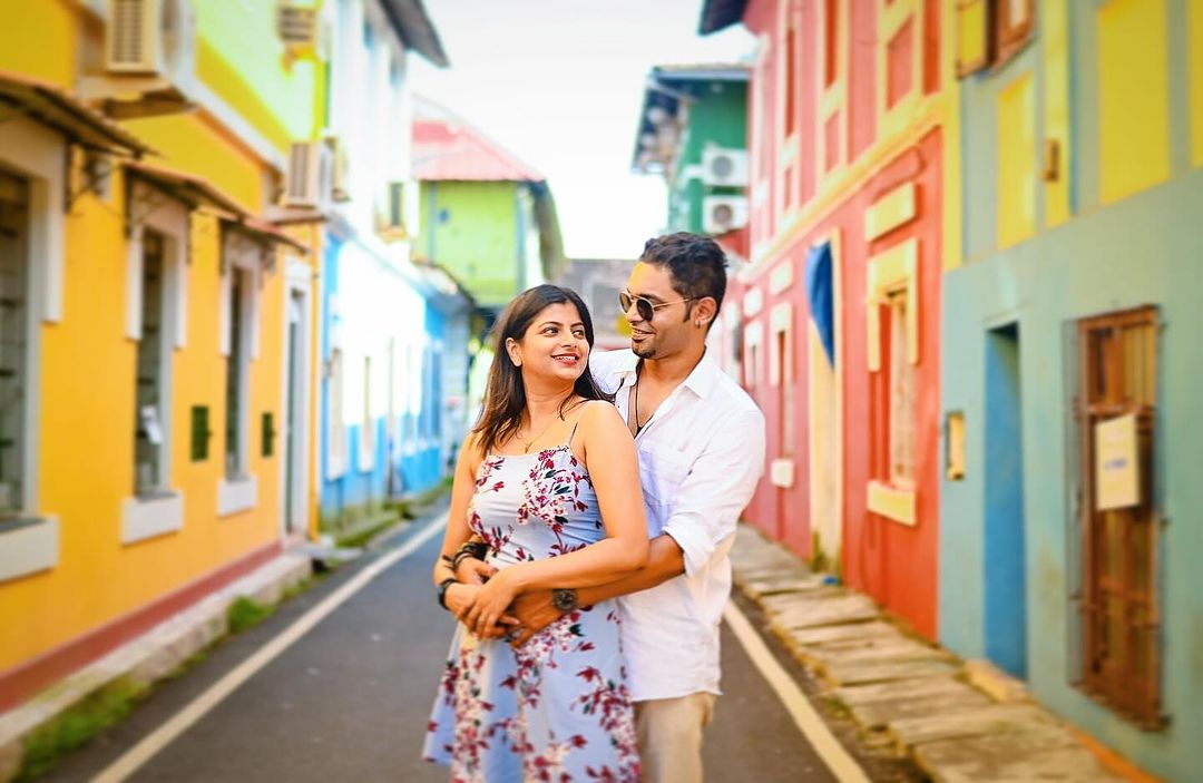 Couple photoshoot showing love in a rainbow-hued neighborhood